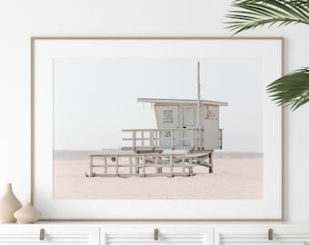 May include: A framed photograph of a white lifeguard stand on a sandy beach. The stand has a sign that reads "Lifeguard Stand Keep Off". The number "24" is visible on the stand.