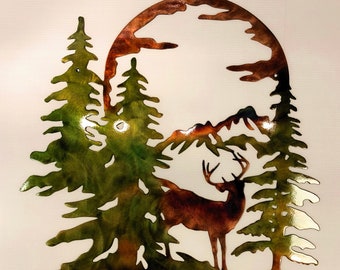 May include: Metal wall art depicting a deer standing in a forest with mountains and a full moon in the background. The art is painted in shades of green, brown, and orange.
