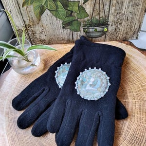 Black fleece gloves &quot;Medallion Collection&quot; romantic woman, female portrait, winter, warm.