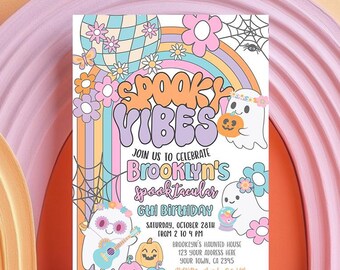 May include: A rectangular birthday invitation card featuring the text SPOOKY VIBES, JOIN US TO CELEBRATE BROOKLYN'S SPOOKTACULAR 6TH BIRTHDAY, SATURDAY, OCTOBER 28TH, FROM 2 TO 4 PM, BROOKLYN'S HAUNTED HOUSE, 123 YOUR ADDRESS HERE, YOUR TOWN, CA 2345, RSVP TO PAM BY OCT 15TH AT 123-756-7890. The design includes ghosts, pumpkins, a disco ball, rainbows, flowers, and spiderwebs in pastel colours.