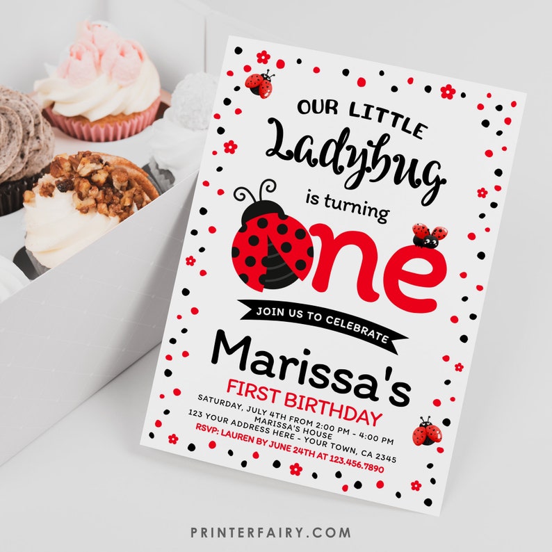 May include: A ladybug-themed first birthday invitation with the text "Our Little Ladybug is turning one." The invitation is white with red and black accents, including ladybug illustrations and floral details. Cupcakes are in the background.
