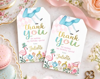 May include: Two rectangular paper gift tags with angled top corners featuring watercolor illustrations of a flamingo, teapot, pocket watch, and cupcakes. The text reads thank you for making my birthday special Love, Juliette.