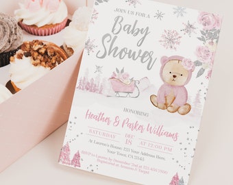 May include: A pink and silver baby shower invitation with a teddy bear wearing a pink hat and a sleigh with a pink blanket. The text on the invitation reads "Join us for a Baby Shower Honoring Heather & Parker Williams Saturday, Dec 18 at 12:00 PM at Lauren's House: 123 Your Address Here. Your Town, CA 2345 RSVP to Lauren by December 2nd at 123.456.7800 Registered at Amazon & Target Printerfairy"