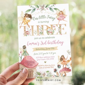 May include: A pink and gold fairy-themed birthday invitation for a girl turning three. The invitation features a large gold number three with flowers and butterflies, and the text "Our little fairy is turning three". The invitation also includes the text "Emma's 3rd birthday" and details about the party, including the date, time, and location.