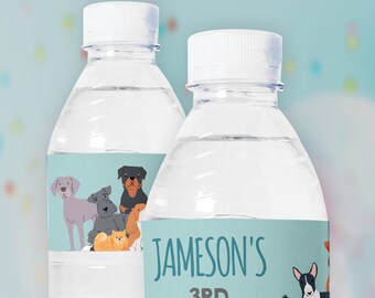 May include: Two clear plastic water bottles with personalized labels. The labels are light blue with a white border and feature a variety of cartoon dogs. One label reads "Jameson's 3rd Birthday".