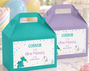 May include: Two rectangular cardboard favor boxes with handles, one teal and one light purple. Each box features a white label printed with the text CONNOR AND Ava Marie's 5TH BIRTHDAY, decorated with colorful stars, a green dragon, and a unicorn.