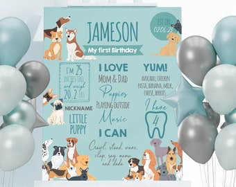 May include: A blue and white printable first birthday sign with a dog theme. The sign features a boy's name, Jameson, and details about his first year, including his height, weight, favorite foods, and activities. The sign is decorated with illustrations of various dog breeds.