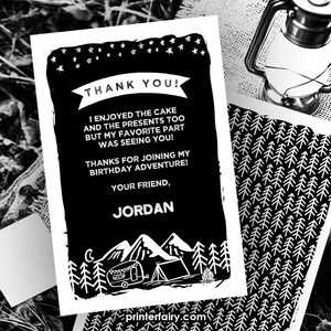 May include: Black and white thank you card with a camping theme. The card says "Thank You!" and includes the text "I enjoyed the cake and the presents too but my favourite part was seeing you! Thanks for joining my birthday adventure! Your friend, Jordan". The card has a black background and white text and illustrations.