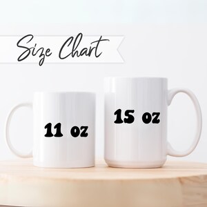 May include: Two white ceramic mugs with black text. The smaller mug is 11 oz and the larger mug is 15 oz.