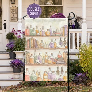 May include: A rectangular garden flag featuring a watercolor illustration of four wooden shelves filled with various glass potion bottles, stacked books, small skulls, lit candles, dried herbs, and pumpkins. A purple sign reads DOUBLE SIDED.