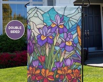 May include: A double-sided garden flag featuring a stained glass design of purple irises and orange flowers. The flag is printed on a white background.