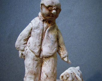 By my Side: One of a kind handmade porcelain sculptures of a man and his dog.