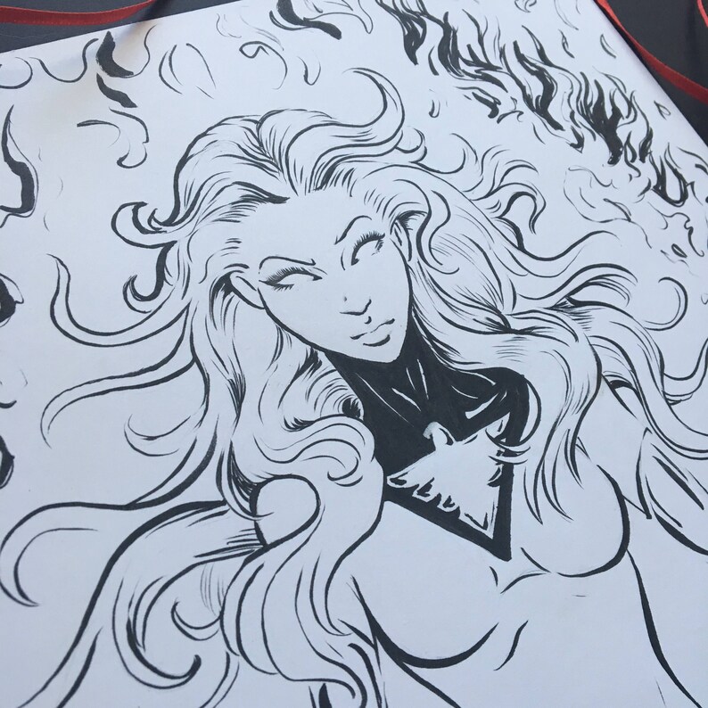 May include: Black and white ink drawing of a woman with long flowing hair and a bird design on her chest. The woman is surrounded by flames.