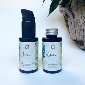 A deep violet glass bottle with a choice of a pump or metal lid holds a natural & highly effective & potent Vitamin C Treatment Gel to protect & nourish & repair skin from Sun damage, Acne & breakouts. very subtle aroma of holy Basil & Rosemary.