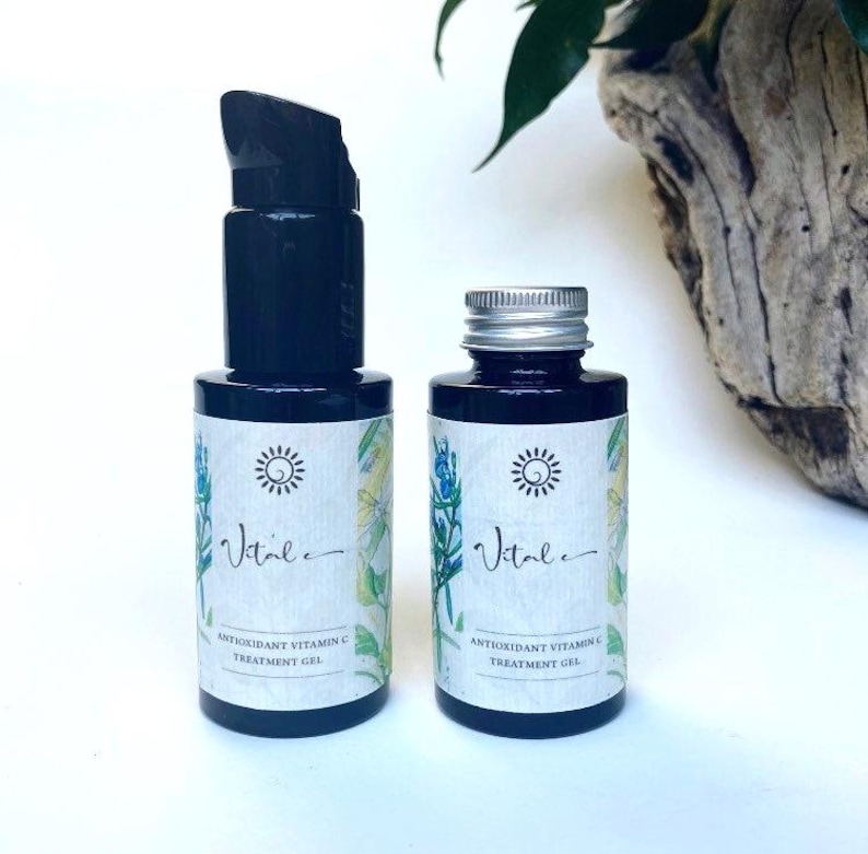 A deep violet glass bottle with a choice of a pump or metal lid holds a natural & highly effective & potent Vitamin C Treatment Gel to protect & nourish & repair skin from Sun damage, Acne & breakouts. very subtle aroma of holy Basil & Rosemary.