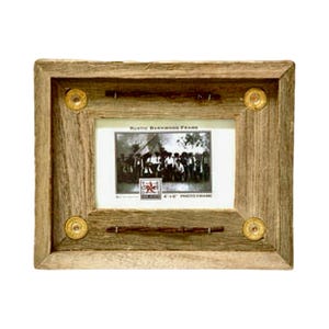 May include: A rustic wooden picture frame with a 4x6 inch opening. The frame is decorated with metal accents and has a distressed wood finish.
