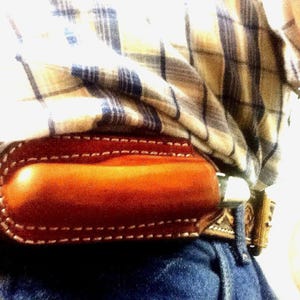 Horizontal Open Top Sheath for a Folding Knife