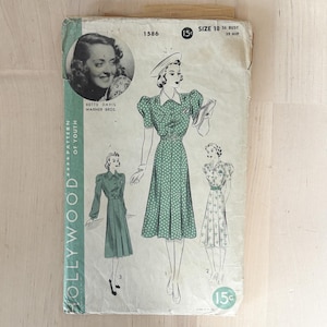 May include: A vintage Hollywood Pattern of Youth sewing pattern envelope, number 1586, featuring a black and white portrait of Bette Davis and illustrations of three dress variations. The envelope is marked size 18, 36 bust, 39 hip, and 15 cents.
