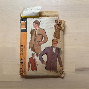 May include: Vintage McCall's 9636 printed sewing pattern for men's single or double-breasted jackets. The pattern envelope features illustrations of men in various jacket styles. Size 44.