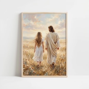 May include: A framed print showing two figures strolling through a field of long grass and wildflowers. The figures are a person in a white robe and a person in a white dress, seen from behind. The background features a soft, cloudy sky.