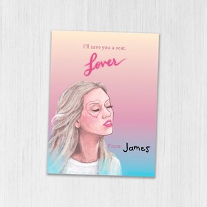 May include: A pink and blue gradient background with a drawing of a woman with blonde hair. The woman has a pink heart drawn over her eye. The text "I'll save you a seat, lover" is written in pink at the top of the image. The text "From: James" is written in black at the bottom of the image.