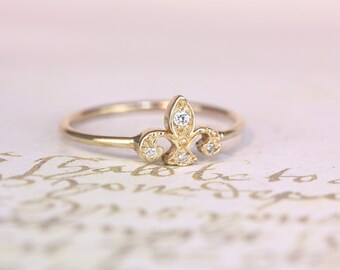 Sweet 14kt. rose gold fleurs de li ring