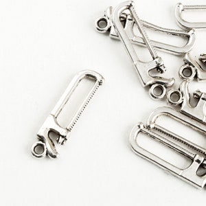 Hacksaw Charms, Antique Silver Tone, 36mm x 7mm - 10 pieces (843)