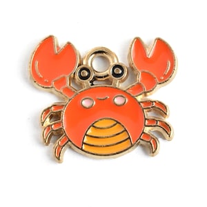 May include: A colorful crab charm with an orange body and claws, and a gold-colored outline. The crab has black eyes and a yellow and orange striped belly. This charm is perfect for jewelry making or other craft projects.