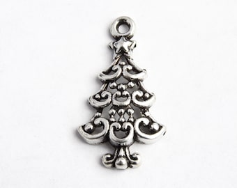 May include: Silver charm in the shape of a Christmas tree with a star on top. The tree is decorated with intricate swirls and bead details.
