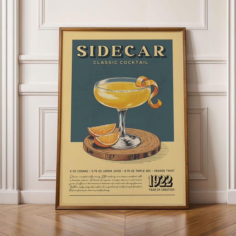 The image is a framed poster advertising a cocktail called "Sidecar Classic Cocktail". The poster features an illustration of a cocktail glass with a lemon twist and orange peel, along with text describing the ingredients and the year of creation, which is the year 1920.