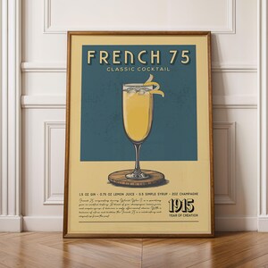 a framed poster advertising a French 75 cocktail.