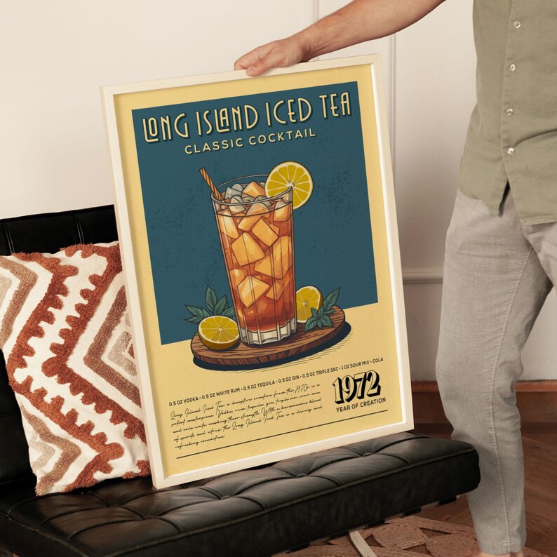 A framed poster advertising a Long Island Iced Tea cocktail, featuring an illustration of a tall glass filled with ice and tea, garnished with lemon slices and herbs.