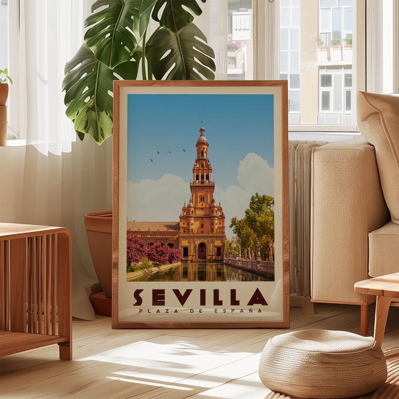 A framed poster of the Plaza de España in Seville, Spain, featuring a large tower and surrounded by lush greenery.