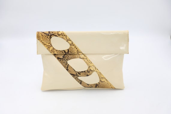 Cream patent shop clutch bag