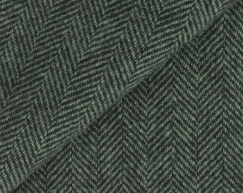 May include: Close-up of a green and black herringbone fabric. The fabric has a textured appearance with a repeating V-shaped pattern. The material appears to be a medium-weight woven textile.