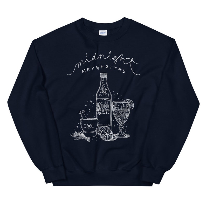 May include: Navy blue sweatshirt with a white graphic design of a bottle of tequila, a mortar and pestle, a lime, and a glass with a lime wedge. The text "midnight margaritas" is written in a cursive font above the graphic.