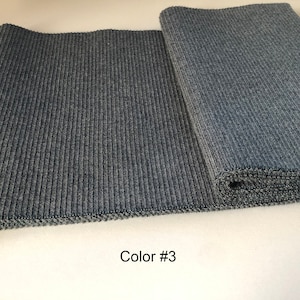 May include: Two pieces of dark gray ribbed fabric, one laid flat and the other rolled up. The text "Color #3" is printed below the fabric.