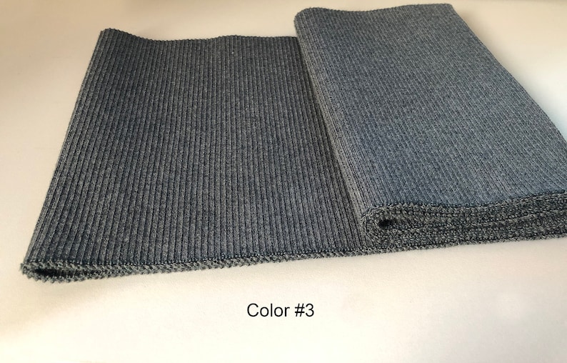 May include: Two pieces of dark gray ribbed fabric, one laid flat and the other rolled up. The text "Color #3" is printed below the fabric.