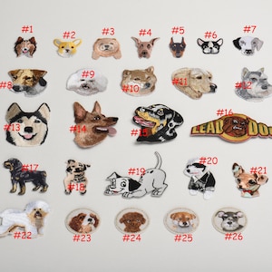 May include: A set of 26 embroidered iron-on patches featuring various dog breeds. The patches are numbered 1 through 26 and include a variety of breeds, including a husky, a bulldog, a poodle, and a schnauzer. The patches are perfect for adding a touch of personality to clothing, bags, or other accessories.