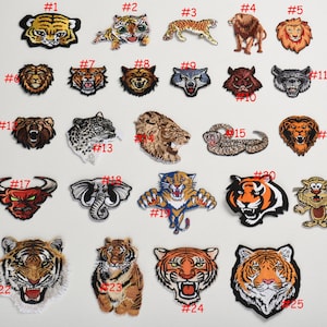 Può includere: Un set di 25 toppe da stirare con diversi disegni di animali, tra cui leoni, tigri, elefanti e serpenti. Le toppe sono colorate e dettagliate, con una varietà di stili e dimensioni.