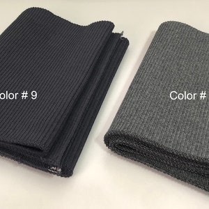 May include: Two rolls of ribbed fabric, one black and one gray. The black fabric is labeled "Color # 9" and the gray fabric is labeled "Color # 3".
