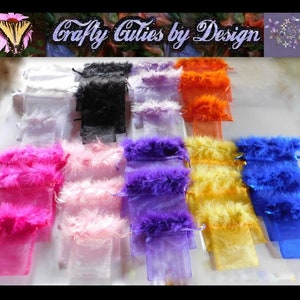 May include: Assortment of colorful organza bags with feather trim. The bags are in the following colors: white, black, purple, pink, yellow, orange, and blue.