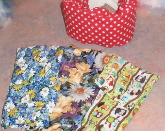 May include: Three fabric squares with different patterns. The first square is blue and white with a floral pattern. The second square is a mix of yellow, white, and purple with a floral pattern. The third square is green and white with a pattern of owls.
