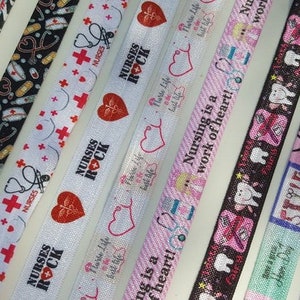 May include: Assortment of colorful ribbon with various designs and text, including "Nurse Proud To Be A Nurse", "Nurses Rock", "Nursing is a work of heart!" and "Love Hair".