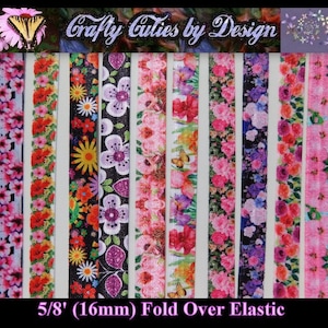 May include: Eight different 5/8 inch (16 mm) wide fold over elastic bands with floral prints. The prints include pink, purple, red, and white flowers on a variety of backgrounds.