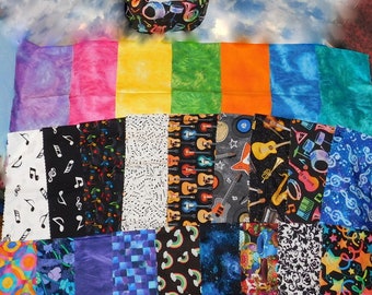May include: A collection of fabric squares with various musical themes. The squares feature musical notes, guitars, drums, and other musical instruments. The fabrics are in a variety of colors, including blue, green, red, yellow, and purple.