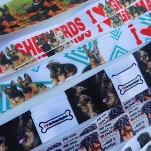 May include: Assortment of colorful ribbon with different dog breeds printed on them. The ribbon has the text "I love German Shepherds" and "All you need is love...and a Rottweiler" printed on them.
