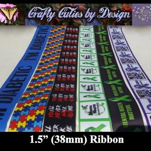 May include: Assortment of 1.5 inch (38mm) wide ribbon featuring various awareness ribbon designs. The ribbons include: "I'm Diabetic", a blue ribbon with white text; a puzzle piece ribbon with blue, yellow, and red puzzle pieces; a black ribbon with white text that reads "You'll Never Walk Alone"; a green ribbon with a butterfly and the text "Mental Health Matters"; and a purple ribbon with the text "Never Ever Give Up".