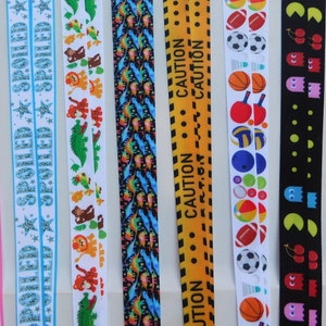 Ruban 5/8" - Enfants et jeux - Mme Pac Man, camions à benne basculante, ballons de sport, attention, dinosaures Ruban gros-grain par mètre