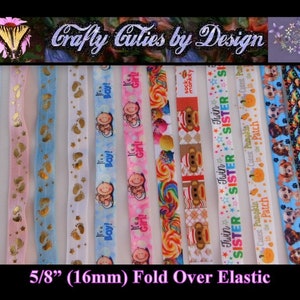 May include: Assortment of 5/8 inch (16mm) fold over elastic ribbon with various designs, including baby footprints, stars, monkeys, candy, and puppies. The ribbon is white with colorful printed designs.